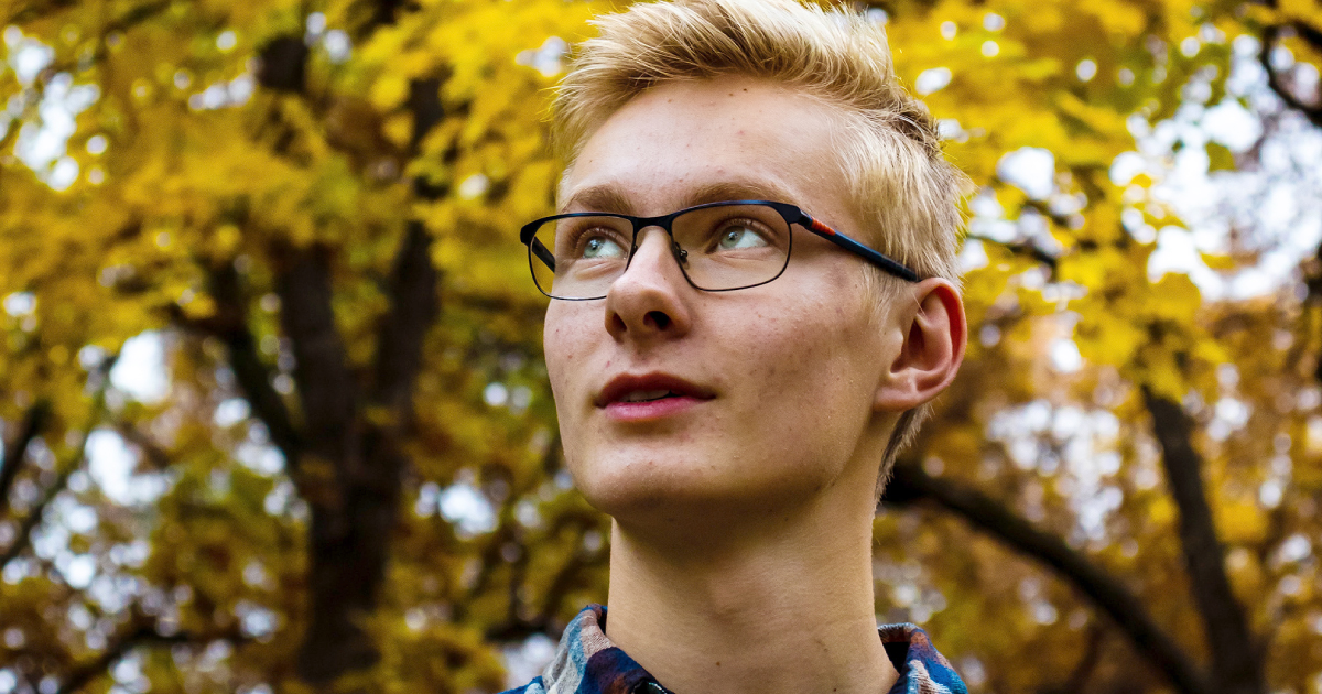 Close-up of a college student on a sunny fall day